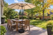Patio umbrella shading a dining table on a Canadian backyard deck