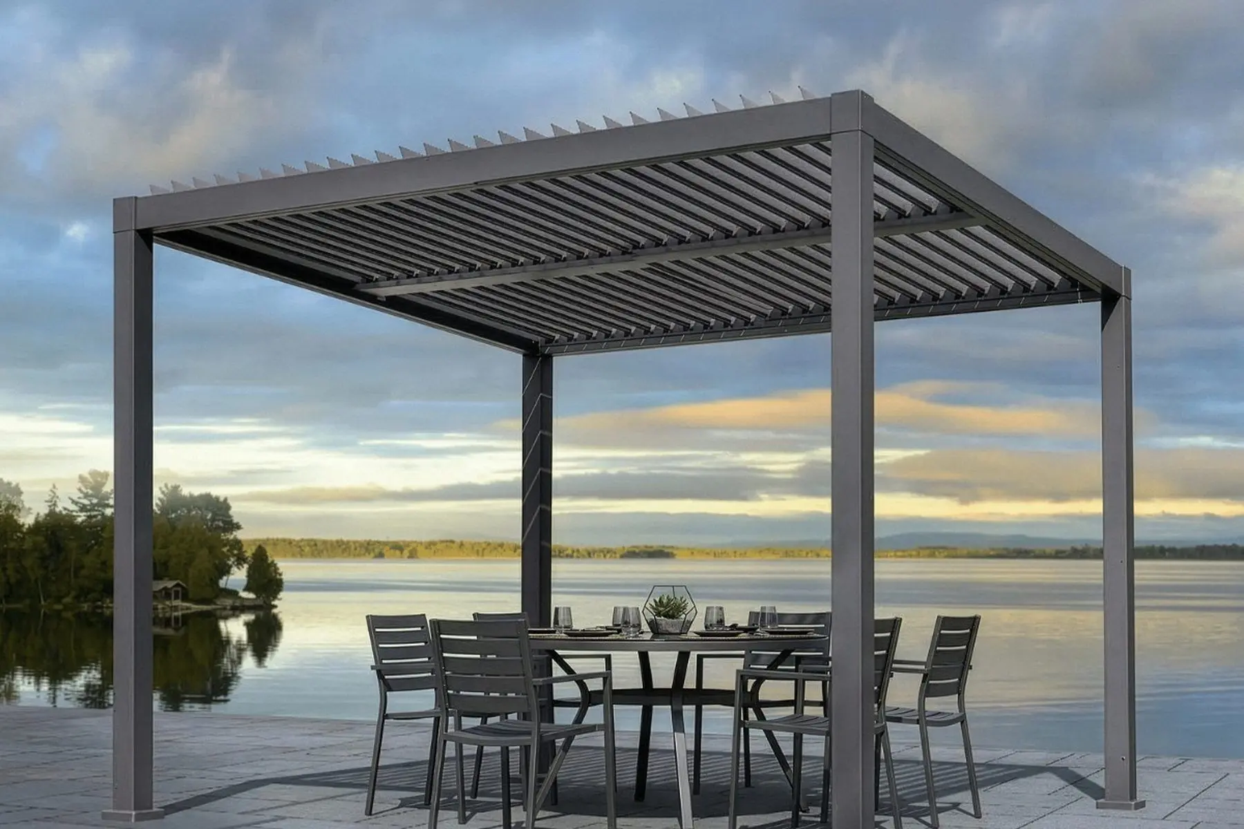 Sojag Hilo louvered aluminum pergola with the blades half open over a lakeside patio dining set